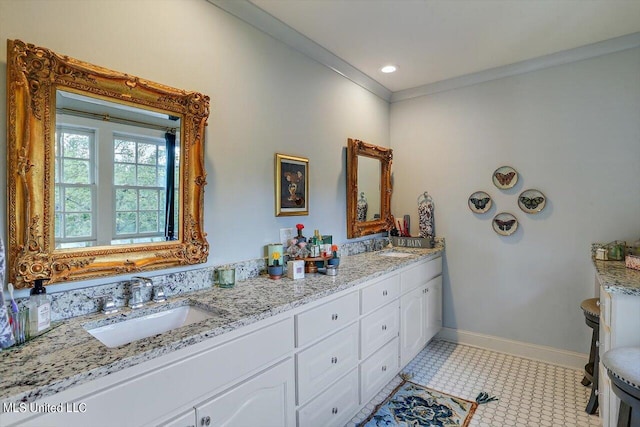 bathroom featuring vanity, ornamental molding, and tile patterned flooring