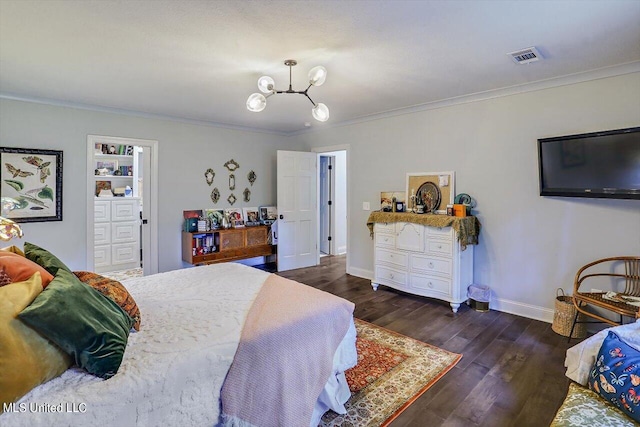 bedroom featuring crown molding, a notable chandelier, and dark hardwood / wood-style floors