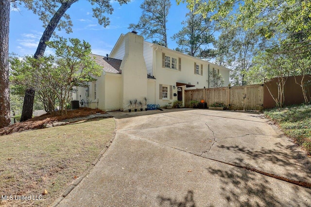 rear view of house with central air condition unit