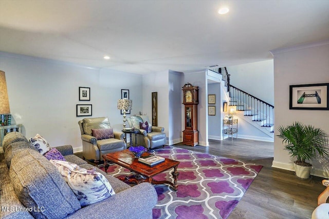 living room with crown molding and dark wood-type flooring