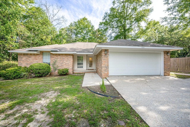 108 Water Oaks Cv, Ocean Springs, MS 39564 - view of front facade featuring brick siding, a garage, and driveway
