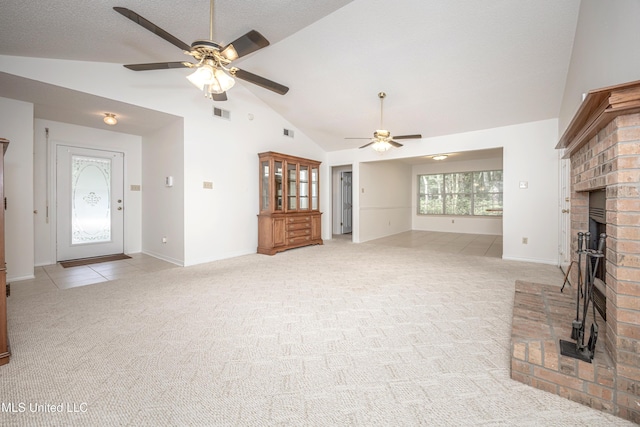 108 Water Oaks Cv, Ocean Springs, MS 39564 - unfurnished living room featuring ceiling fan, light colored carpet, a fireplace, baseboards, and high vaulted ceiling