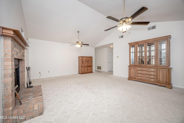 108 Water Oaks Cv, Ocean Springs, MS 39564 - unfurnished living room with a ceiling fan, light colored carpet, baseboards, a fireplace, and high vaulted ceiling