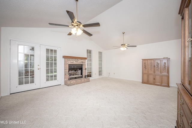 108 Water Oaks Cv, Ocean Springs, MS 39564 - unfurnished living room featuring vaulted ceiling, french doors, a ceiling fan, carpet floors, and baseboards