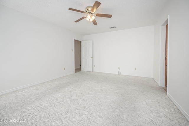 108 Water Oaks Cv, Ocean Springs, MS 39564 - spare room with a ceiling fan, light colored carpet, baseboards, and a textured ceiling