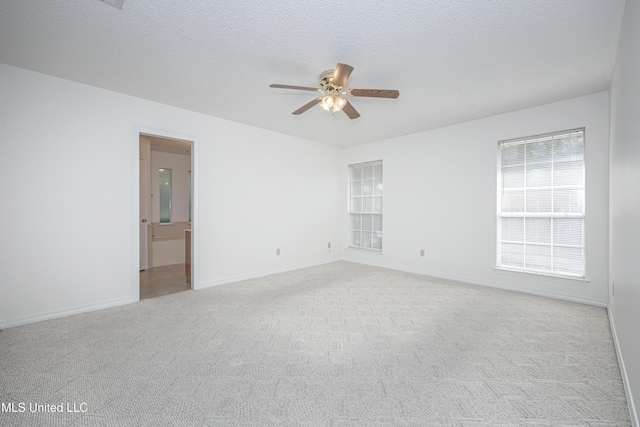 108 Water Oaks Cv, Ocean Springs, MS 39564 - unfurnished room featuring ceiling fan, light colored carpet, baseboards, and a textured ceiling