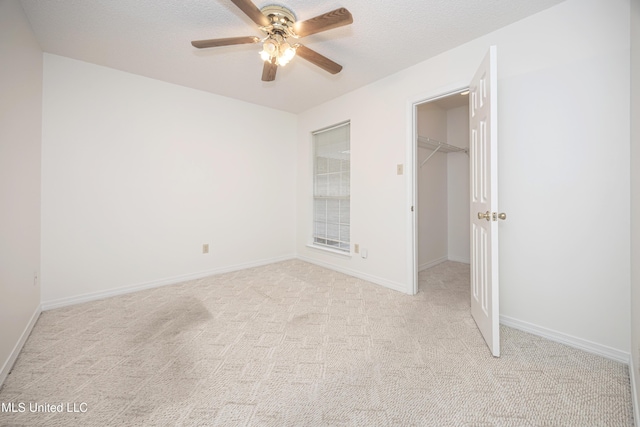 108 Water Oaks Cv, Ocean Springs, MS 39564 - unfurnished bedroom with light carpet, a spacious closet, a closet, ceiling fan, and baseboards