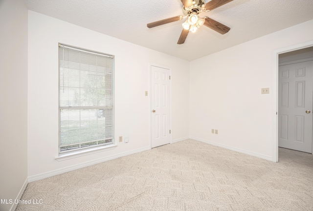 108 Water Oaks Cv, Ocean Springs, MS 39564 - spare room featuring light carpet, ceiling fan, and baseboards