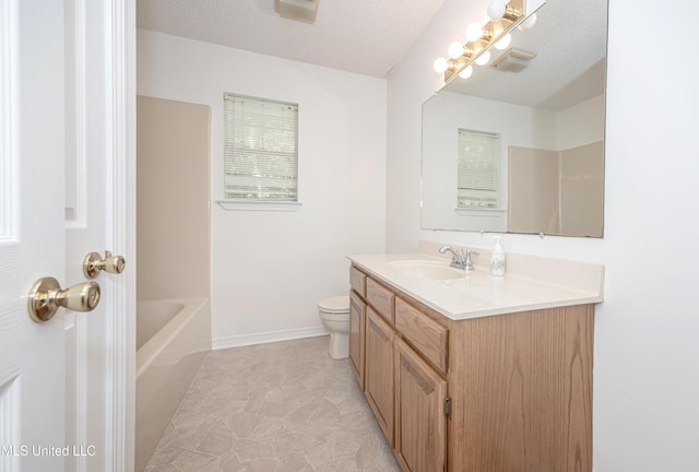 108 Water Oaks Cv, Ocean Springs, MS 39564 - full bathroom with vanity, toilet, a bathtub, and baseboards