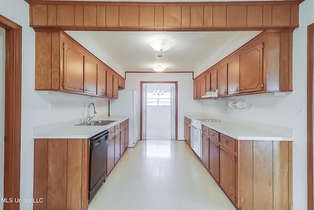 kitchen featuring white appliances and sink