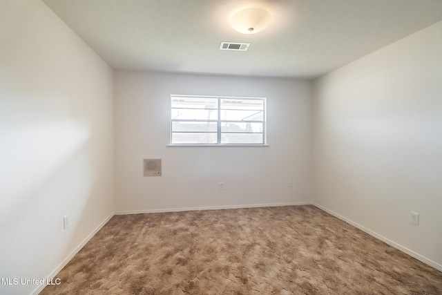 spare room featuring carpet