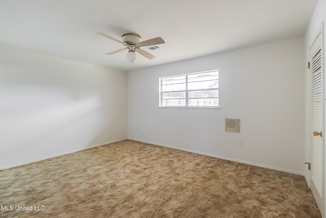 carpeted empty room with ceiling fan