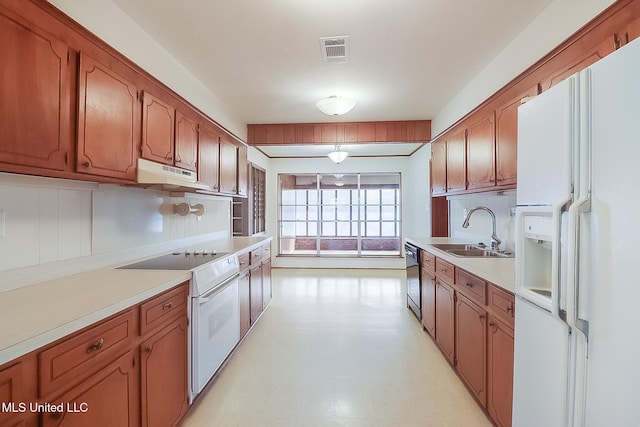 kitchen with white appliances and sink