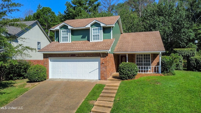 view of front of house with a front lawn and a garage