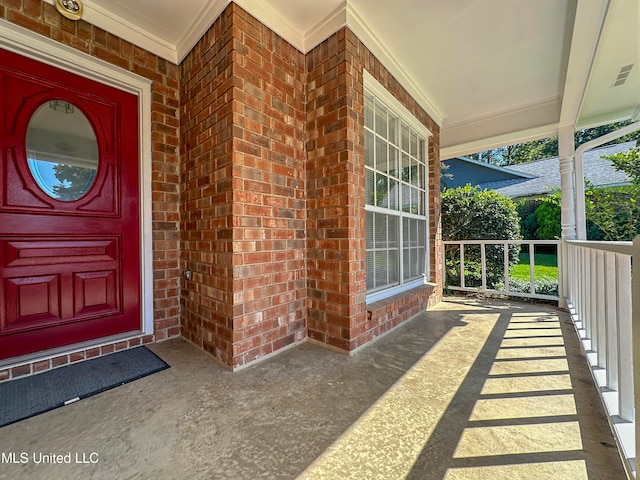 doorway to property with covered porch