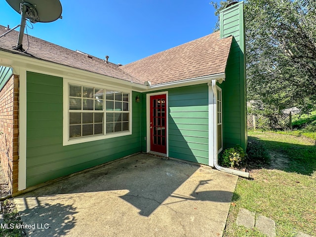 entrance to property with a yard