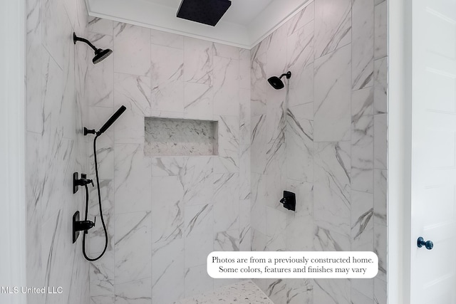 full bath featuring tiled shower