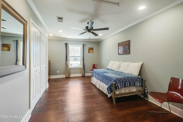 bedroom featuring recessed lighting, crown molding, baseboards, and wood finished floors