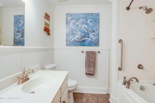 bathroom featuring toilet, crown molding, a bath, and wainscoting