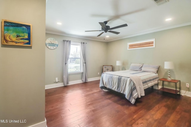 bedroom with baseboards, visible vents, ornamental molding, wood finished floors, and recessed lighting