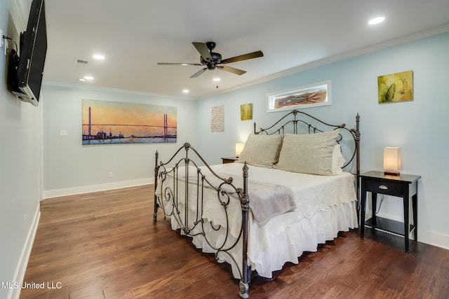 bedroom with crown molding, baseboards, wood finished floors, and recessed lighting