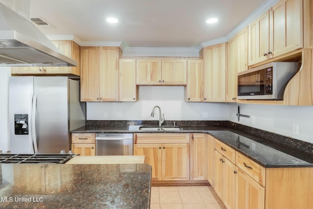 kitchen with light tile patterned floors, light brown cabinets, a sink, appliances with stainless steel finishes, and range hood