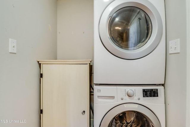 laundry area featuring laundry area and stacked washing maching and dryer