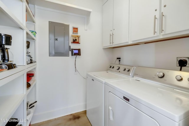 clothes washing area featuring cabinet space, washing machine and dryer, electric panel, and baseboards