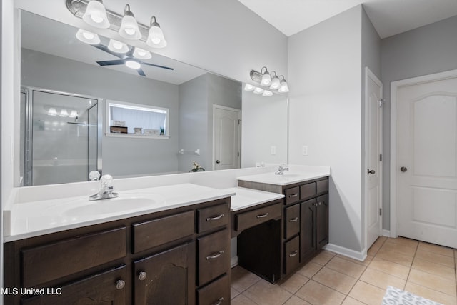 bathroom with tile patterned flooring, vanity, a shower with door, and ceiling fan