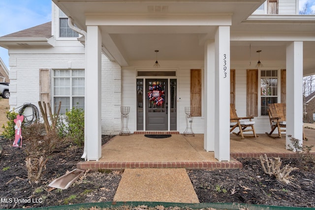 doorway to property featuring a porch