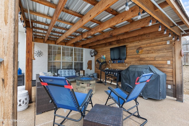 view of patio / terrace featuring a grill and a fire pit