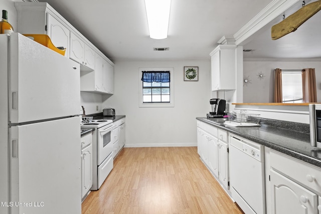 kitchen with white appliances, white cabinetry, crown molding, and a sink