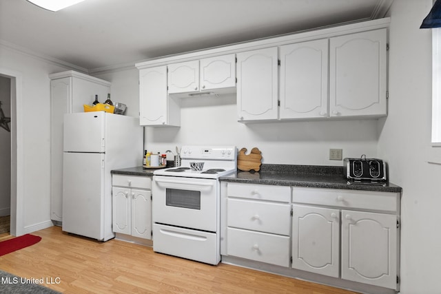 kitchen with white appliances, dark countertops, and white cabinets