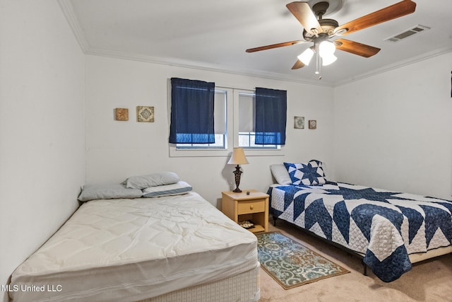 bedroom with visible vents, crown molding, carpet flooring, and ceiling fan