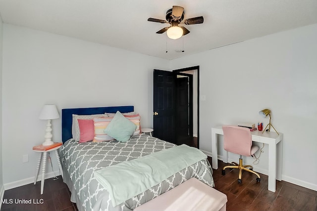 bedroom featuring ceiling fan, baseboards, and wood finished floors