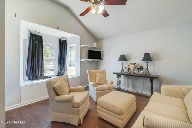 living area with lofted ceiling, ceiling fan, baseboards, and wood finished floors