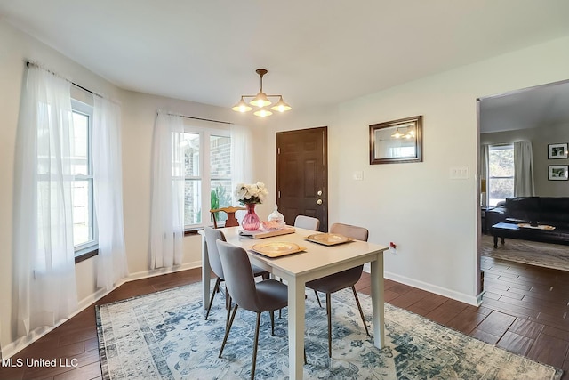 dining room with dark wood-style floors and baseboards