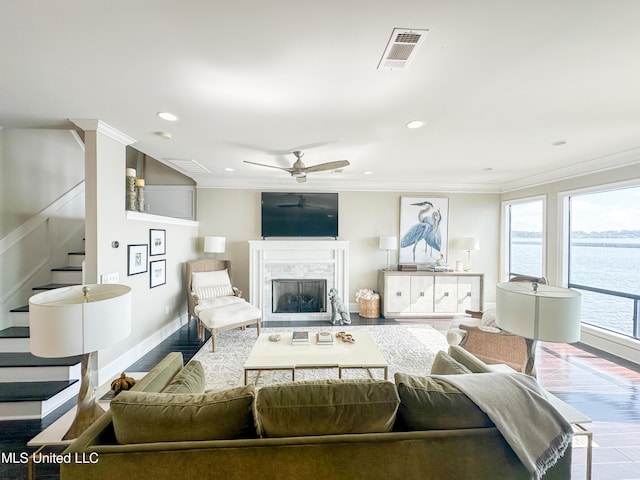 122 Breakers Ln, Ridgeland, MS 39157 - living area with stairway, ornamental molding, a fireplace, and wood finished floors