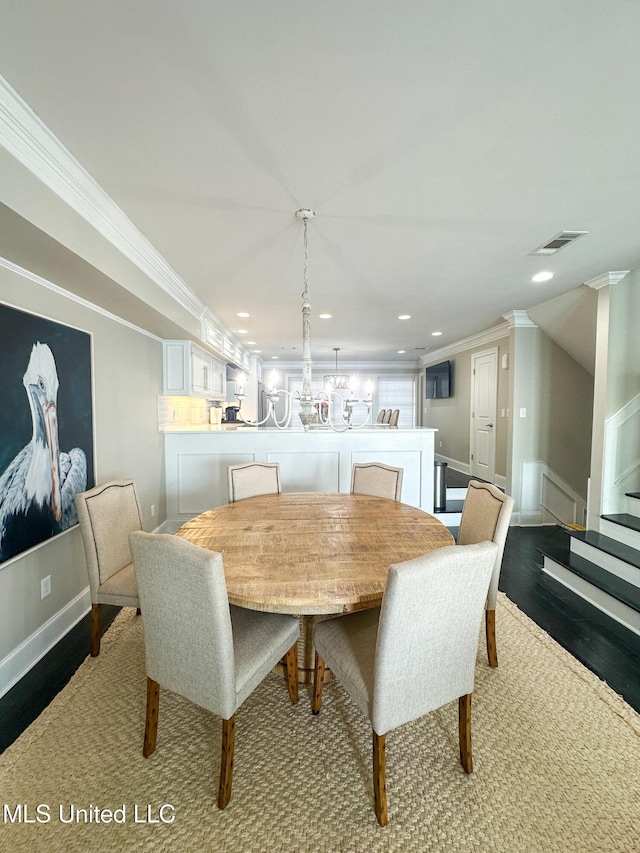 122 Breakers Ln, Ridgeland, MS 39157 - dining space featuring wood finished floors, a notable chandelier, crown molding, visible vents, and recessed lighting