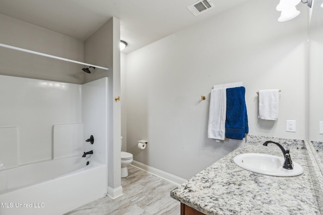 full bathroom with shower / tub combination, vanity, and toilet