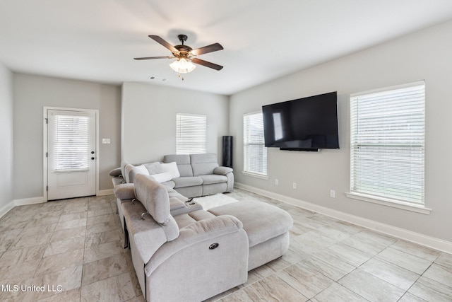 living room with ceiling fan