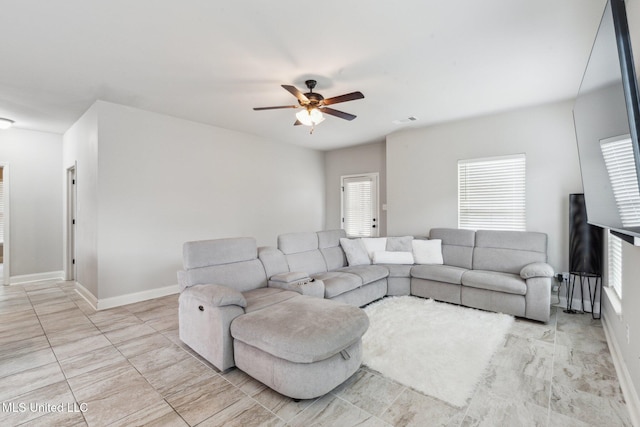 living room with ceiling fan