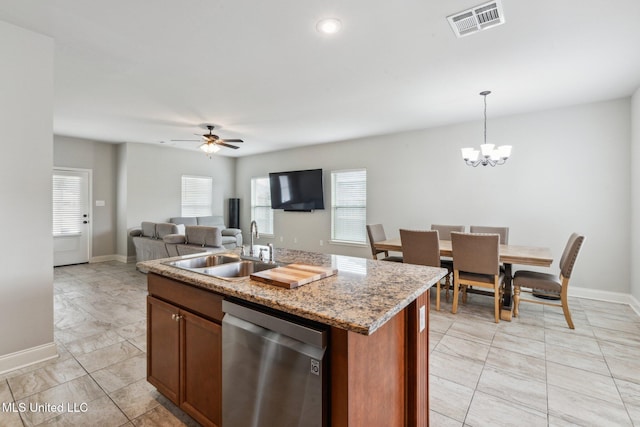 kitchen featuring sink, hanging light fixtures, stainless steel dishwasher, a center island with sink, and ceiling fan with notable chandelier