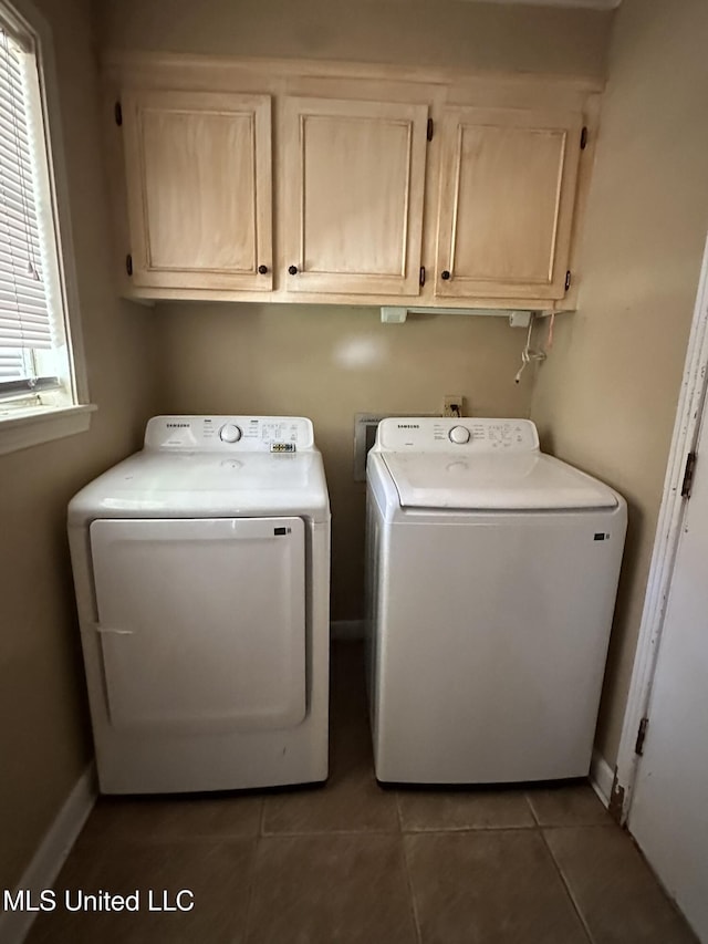 1052 Briarfield Rd, Jackson, MS 39211 - washroom featuring cabinet space, washing machine and clothes dryer, tile patterned floors, and baseboards