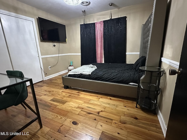 1052 Briarfield Rd, Jackson, MS 39211 - bedroom with wood finished floors and baseboards