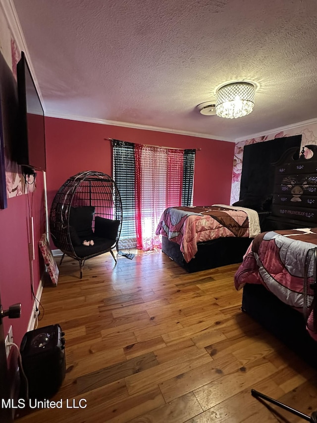 1052 Briarfield Rd, Jackson, MS 39211 - bedroom featuring a textured ceiling, wood-type flooring, ornamental molding, and a chandelier