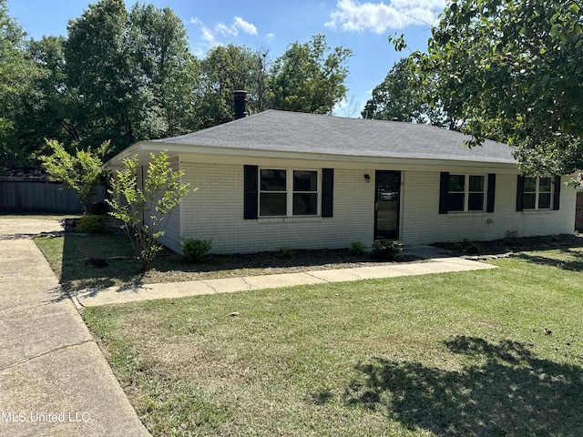 2389 Napoleon Ave, Pearl, MS 39208 - ranch-style home with brick siding, fence, roof with shingles, and a front yard