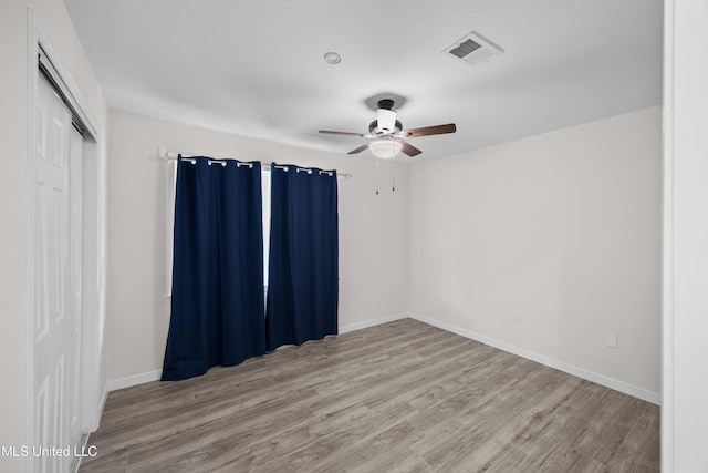 2389 Napoleon Ave, Pearl, MS 39208 - empty room featuring visible vents, baseboards, a ceiling fan, and wood finished floors