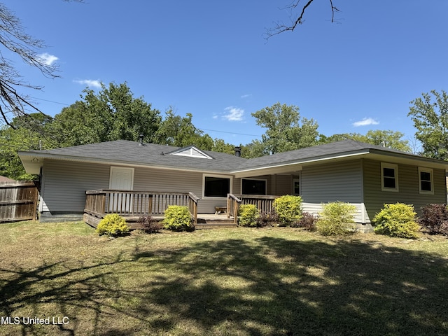 2389 Napoleon Ave, Pearl, MS 39208 - rear view of property featuring fence, a lawn, and a wooden deck