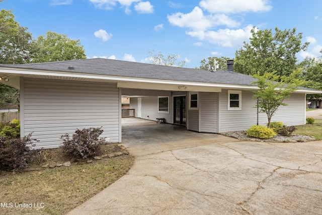 2389 Napoleon Ave, Pearl, MS 39208 - exterior space with driveway, a carport, and roof with shingles
